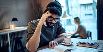 Student researching their dissertation proposal