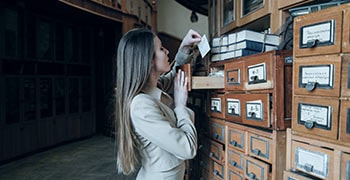 Student looking at reference cards