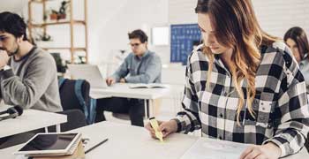 Female student checking her work with a highlighter