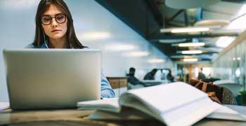 Male student working on his dissertation proposal