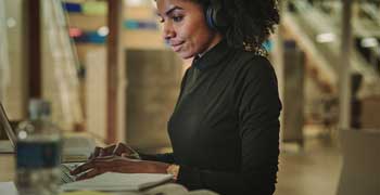 Female student working on her dissertation